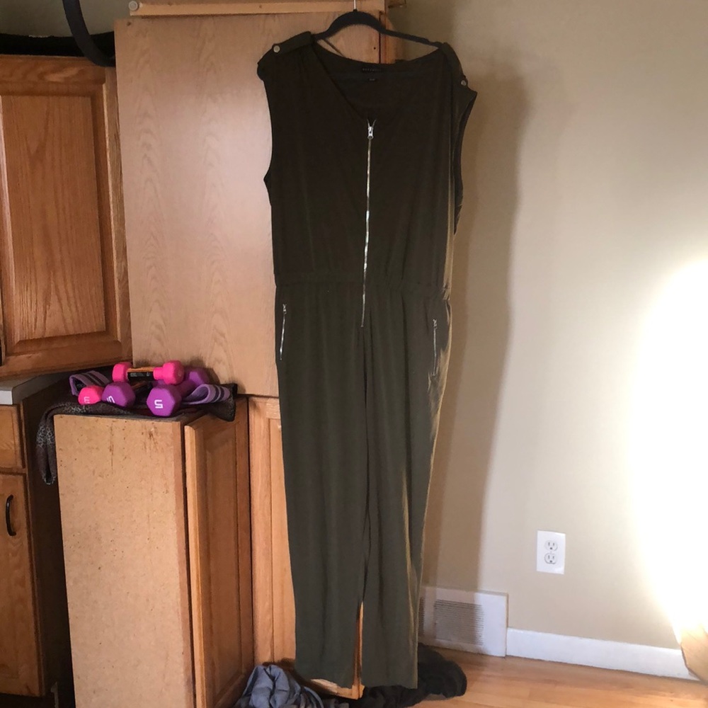 Military green jumpsuit with silver zipper details